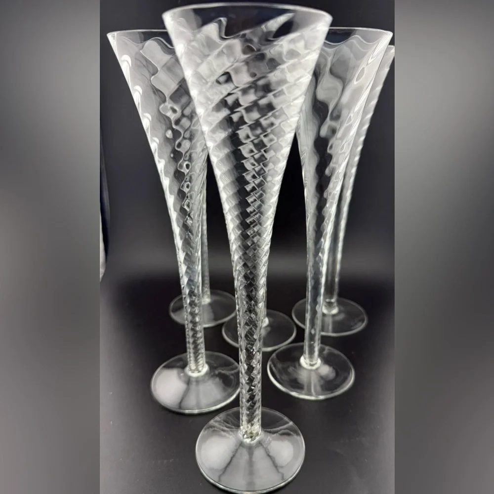 7 Crate & Barrel “Renoir” hollow stemmed champagne flutes. 6oz 10”H
